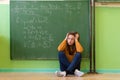 Teenager girl in math class overwhelmed by the math formula. Pressure, Education concept. Royalty Free Stock Photo
