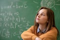Teenager girl in math class overwhelmed by the math formula. Royalty Free Stock Photo