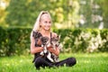 Teenager girl playing with small kittens at warm and sunny summer day Royalty Free Stock Photo