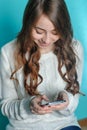 Teenager girl playing on your phone Royalty Free Stock Photo