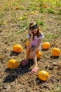 Teenager girl and pumpkin in the vegetable garden. A girl with a pumpkin wearing glasses for Halloween Royalty Free Stock Photo