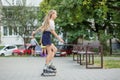 Teenager girl quickly roller skates in skate park. Active lifestyle, hobby and childhood concept Royalty Free Stock Photo