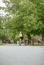 Teenager girl quickly roller skates in skate park. Active lifestyle, hobby and childhood concept