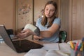 Teenager girl, resting from lessons and learning, playing with an animal, rat mouse, video tutoring lessons, home