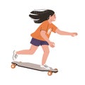 Teenager girl riding skateboard at fast speed. Young happy skater on skate board. Cool active skateboarder. Modern