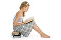 Teenager girl sit on floor and reading book