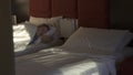 Teenager girl sleeping on bed in hotel