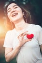 Teenager girl smile with love heart listening music