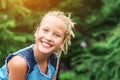 Teenager girl smiling with perfect smile and white teeth in a park . Royalty Free Stock Photo