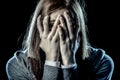 Teenager girl in stress and pain suffering depression looking sad and scared covering her face Royalty Free Stock Photo