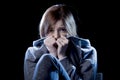 Teenager girl in stress and pain suffering depression sad and scared in fear face expression Royalty Free Stock Photo