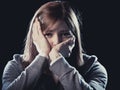 Teenager girl in stress and pain suffering depression sad and scared in fear face expression Royalty Free Stock Photo