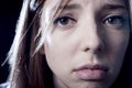 Teenager girl in stress and pain suffering depression sad and scared in fear face expression Royalty Free Stock Photo