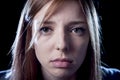 Teenager girl in stress and pain suffering depression sad and scared in fear face expression Royalty Free Stock Photo