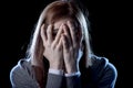 Teenager girl in stress and pain suffering depression sad and scared in fear face expression Royalty Free Stock Photo