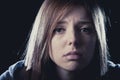 Teenager girl in stress and pain suffering depression sad and scared in fear face expression Royalty Free Stock Photo