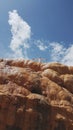 teenager girl on top of a mountain against blue sky