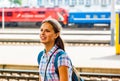 Teenager girl traveling alone at train station