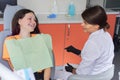 Teenager girl treating teeth at dentist office, consultation of orthodontist dentist