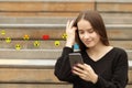 Teenager girl using smartphone sending emojis, watching video live streamings