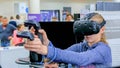 Teenager girl using virtual reality headset at technology show