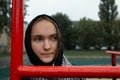 Teenager girl on a walk with a hood on her head, close up Royalty Free Stock Photo