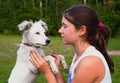 Teenager girl with white dalmatin puppy