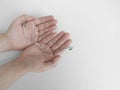 Teenager hands hold orthodontic device,removable metal braces for upper teeth,used with dental rubber bands.Copy space