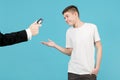 Teenager happily accepts a car key, which a man in a jacket holds out to him Royalty Free Stock Photo