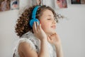A teenager in headphones listens to music. Music brings pleasure within isolation