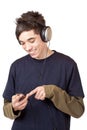 Teenager with headset use mp3 music player Royalty Free Stock Photo