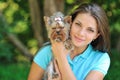 Teenager with her puppy dog in the park