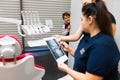 Teenager is hiding peeking out of the wall as dentists look at his x-ray..Boy still does not understand the seriousness of the hea Royalty Free Stock Photo