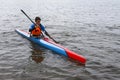 Teenager on his canoe practicing kayak