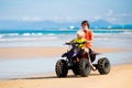 Kids on quad bike. Off road all terrain vehicle. Royalty Free Stock Photo