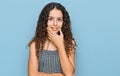 Teenager hispanic girl wearing casual clothes looking confident at the camera smiling with crossed arms and hand raised on chin Royalty Free Stock Photo