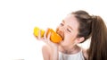 Teenager holding citrus orange fruit. Beautiful little girl with oranges, lemons, grapefruits, vitamin. Isolated on
