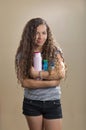 Teenager holding hair products