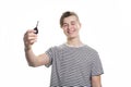 A teenager holding the key of his first car Royalty Free Stock Photo