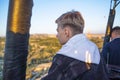 Teenager in hot air balloon watching Sunrise, hot air balloons during Sunrise