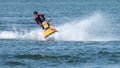 Teenager on Jet Ski-Water Sports in the summer having fun on the beach