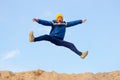 Teenager jumping against the sky. Parkour