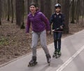 Teenager kids roller skating in the park Royalty Free Stock Photo