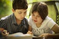 Teenager kids siblings sister help her brother with homework task