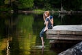 Teenager on a lakeside dock Royalty Free Stock Photo