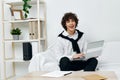 teenager laptop sitting on white sofa online training communication Royalty Free Stock Photo