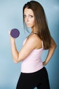 Teenager lifting dumbbell