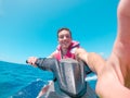 Teenager man enjoying summer in a jet ski in the middle of the sea having fun racing alone and isolated Royalty Free Stock Photo