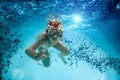 Teenager in the mask and snorkel swim underwater. Royalty Free Stock Photo