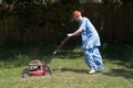 Teenager Mowing the Lawn 6 Royalty Free Stock Photo